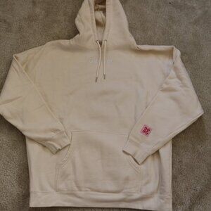 Glossier Off-White Hoodie with Pink Detail